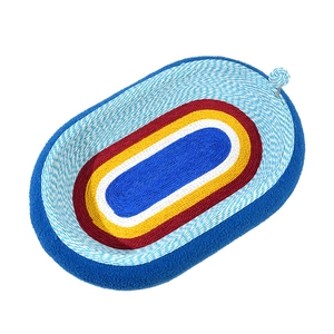 Oval sisal cat scratcher bed with colorful woven design and spring-mounted toy ball