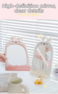Detail of the pink rabbit ear vanity mirror with a stable base and storage tray