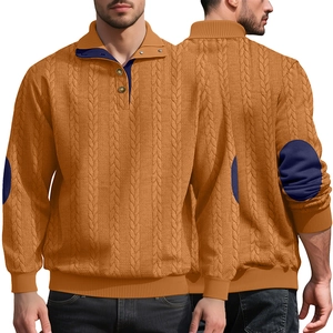 Detail of men's knitted sweater featuring cable knit texture and navy elbow patches