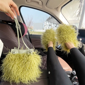 Light green faux fur bucket bag and matching fluffy slippers in a car lifestyle setting