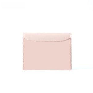Detailed view of pale pink leather wallet with curved card slot and precise stitching