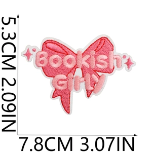 Pink bow embroidered patch with Bookish Girl text and detailed fabric stitch texture