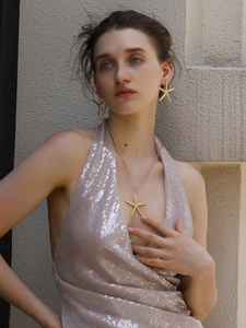 Detail shot of hammered texture on 18K gold-plated stainless steel starfish jewelry set