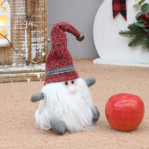 Charming Christmas gnome plush with red knit hat, bell detail and long white beard decor
