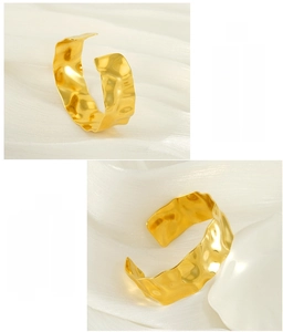 Detail of 18K gold plated stainless steel bangle with hammered texture and C-shape open cuff