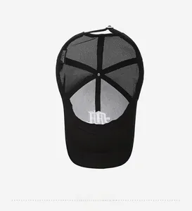 Interior view of black mesh trucker hat showing embroidered lining and care label detail