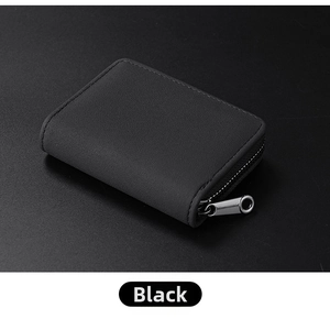 Top view of a sleek black matte leather card holder with secure silver metal zipper