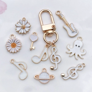 Mix of 20 white enamel charms including daisy, guitar, and note shapes for DIY jewelry making