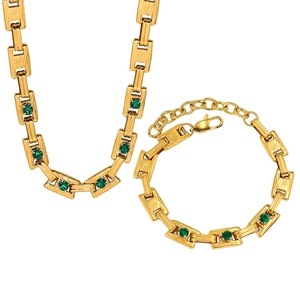 Detail of 18K gold plated stainless steel necklace and bracelet set with green crystals