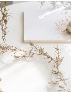 Close-up of champagne gold glittery decorative branch for Christmas festive home decor