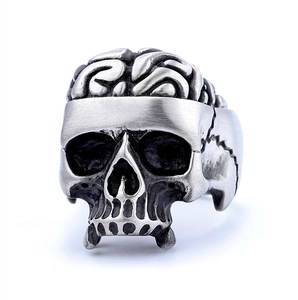 Detailed close-up of gothic skull ring featuring brain texture and retro punk style