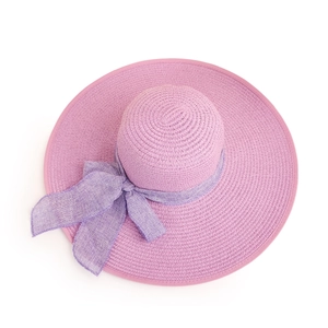 Detail of the lavender wide brim straw hat with matching bow knot and fine woven texture