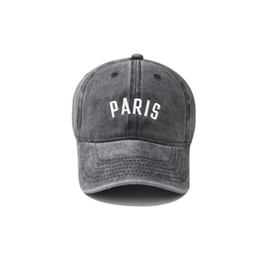 Washed cotton baseball cap in dark grey with white PARIS embroidery on a white background