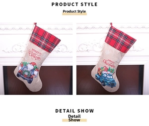 Detail of burlap Christmas stockings with blue truck and Santa Claus on white fireplace