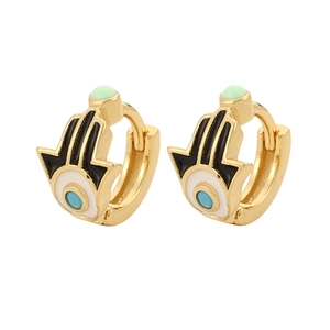 Detail of gold-plated Hamsa Hand and Evil Eye earrings with colorful enamel accents