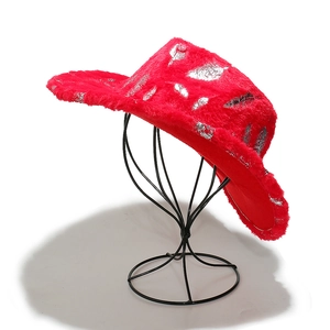 Detail of red plush cowboy hat with silver feather patterns on a display stand