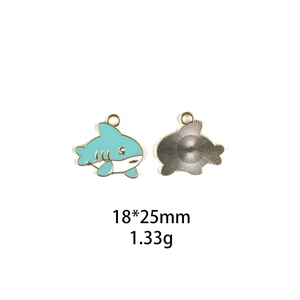 Cartoon shark alloy pendant in teal and white finish with dimensions 18x25mm