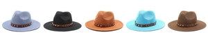 Detail of five colorful woven fedora hats with studded leather bands and arrow accents