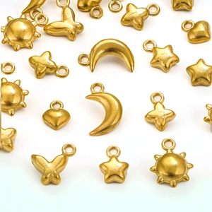 Golden stainless steel DIY jewelry pendants set featuring moon, sun, star and heart shapes