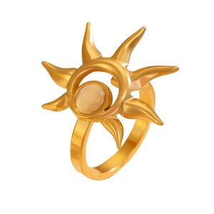 Detail of gold sunflower ring featuring a yellow cat eye stone and sunray texture