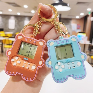Mini bear-shaped Tetris game console keychain in vibrant orange and blue colors