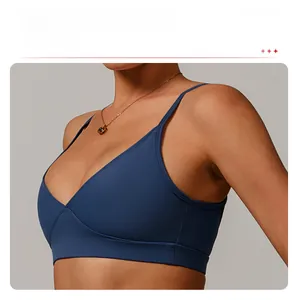 Detail of navy blue sports bra featuring hidden elastic band and anti-shock design