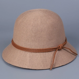 Detail of khaki knitted sun hat featuring breathable mesh texture and decorative brown leather cord