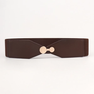 Detail of brown elastic waist belt with a round gold metal buckle on a white background