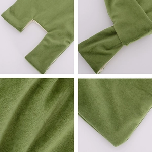 Close-up of green velvet fabric texture and leg opening seams of the pet grooming hammock