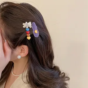2-piece set of flocked bear and wavy purple hair clips with colorful heart charms
