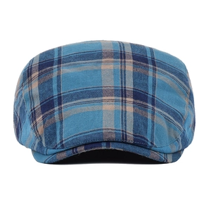 Detailed close-up of blue and brown checkered cotton flat cap with classic plaid pattern