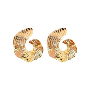 Minimalist gold spiral earrings with wavy texture on a clean white background