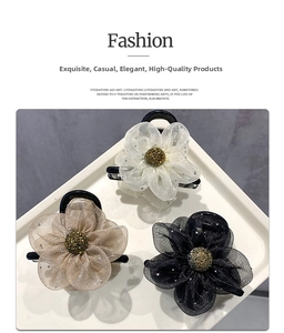 Close-up of three mesh flower hair claws with rhinestones and shimmering petal details