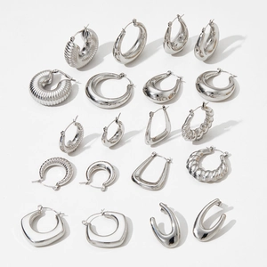 Collection of silver hollow hoop earrings in smooth and textured stainless steel designs