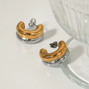 Two-tone C-shape hoop earrings in polished gold and silver stainless steel minimalist style