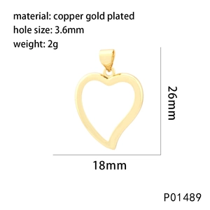 Macro view of heart-shaped copper gold-plated pendant with dimensions 18x26mm