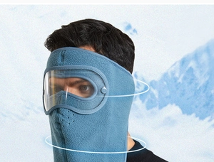 Detail of blue polar fleece face mask with integrated anti-fog goggles for winter outdoor cycling