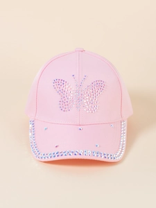 Macro detail of pink baseball cap featuring sparkling rhinestone butterfly and brim decor