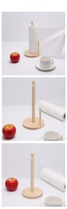 Multiple views of a vertical wooden paper towel holder with a round base and natural finish