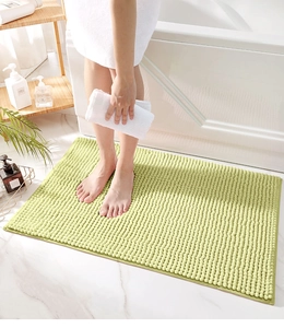 Close-up of light green chenille bathroom rug showing soft absorbent microfiber texture