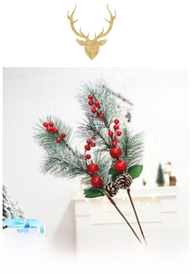 Close-up of PVC cedar branch with red berries and pine cones featuring white snow effect
