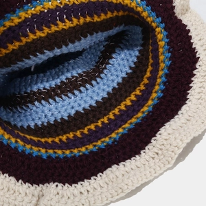 Detailed macro shot of multicolor striped crochet sun hat with wavy scalloped edge