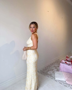 Close-up of yellow floral lace embroidery on elegant backless slim-fit party dress