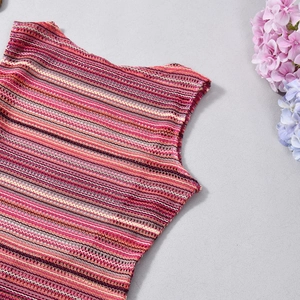 Detail of the colorful striped knit pattern with open-work crochet texture on the neckline