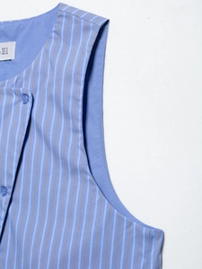 Detail shot of blue vertical striped vest showing neckline texture and inner size label