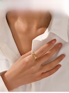 Detail of 18K gold plated stainless steel hollow chain ring worn on finger