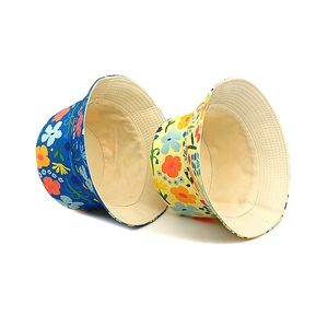 Floral print bucket hats for kids in blue and yellow colors with reversible design