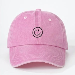 Pink vintage washed cotton baseball cap with embroidered smiley face for sun protection