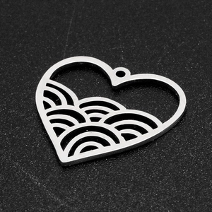 Detailed view of heart-shaped stainless steel pendant with internal wavy hollow design