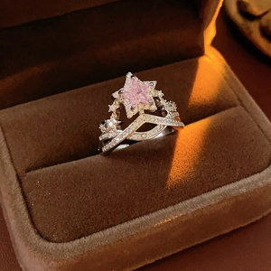 Detail of pink star zircon ring with double layered pave band on velvet jewelry box